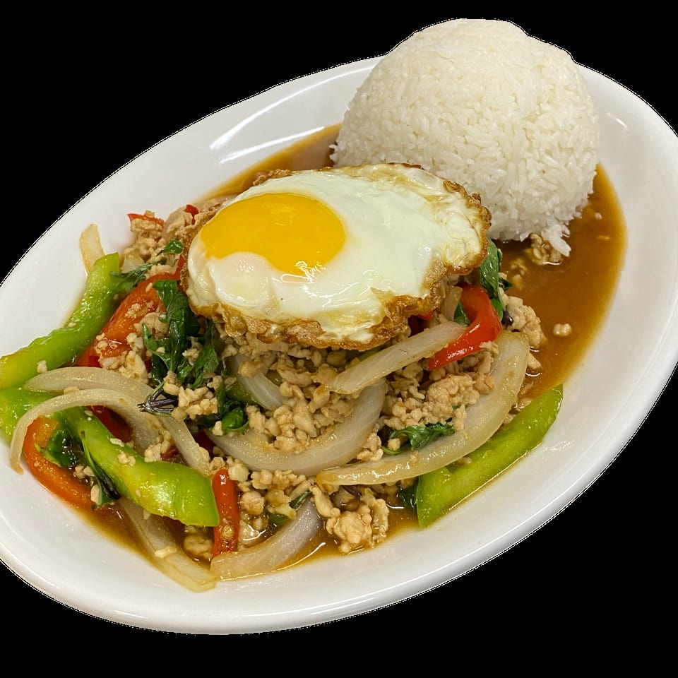 Thai basil chicken with bell peppers, onions, and a fried egg, served with white rice.